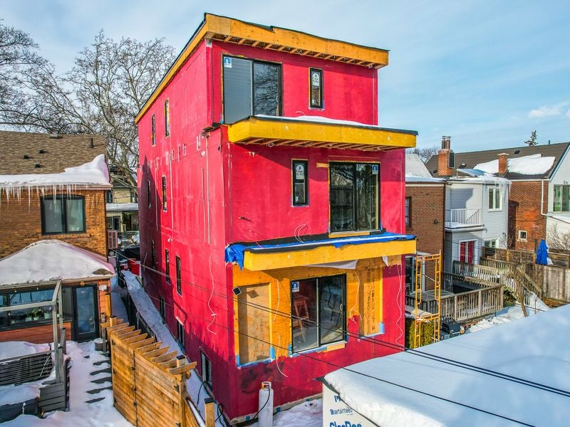 Rear view of three-storey multiplex with GlasRoc fire-rated sheathing and window openings