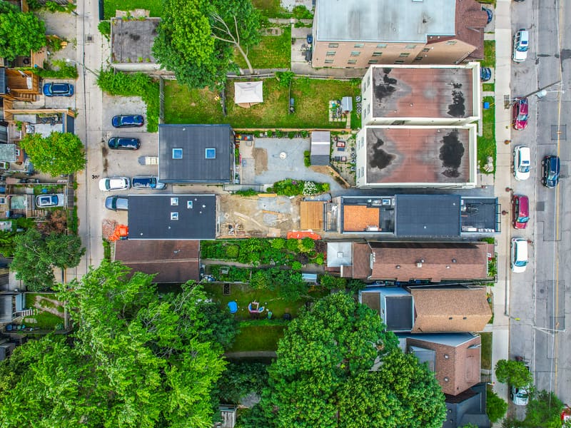 Aerial top-down view showing multiplex with garden suite in Leslieville backyard