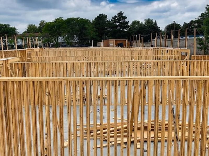 First-floor wood stud wall framing showing partition layout for townhome units