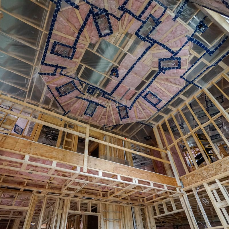 Mineral wool insulation in fire-rated wall assembly