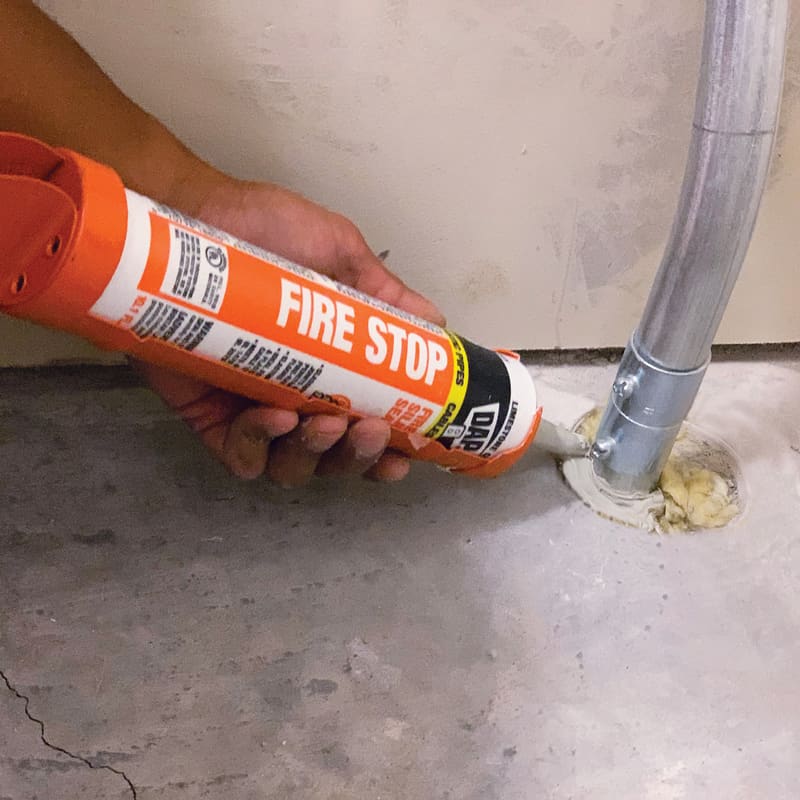 Firestop sealant around pipe penetration