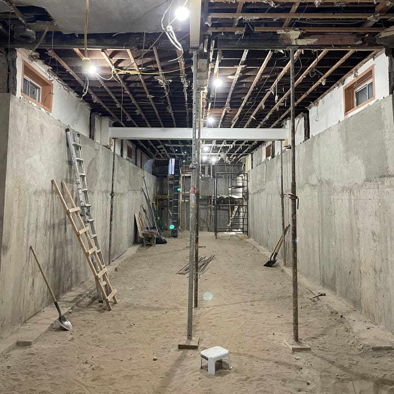 Temporary shoring supporting structure during beam work