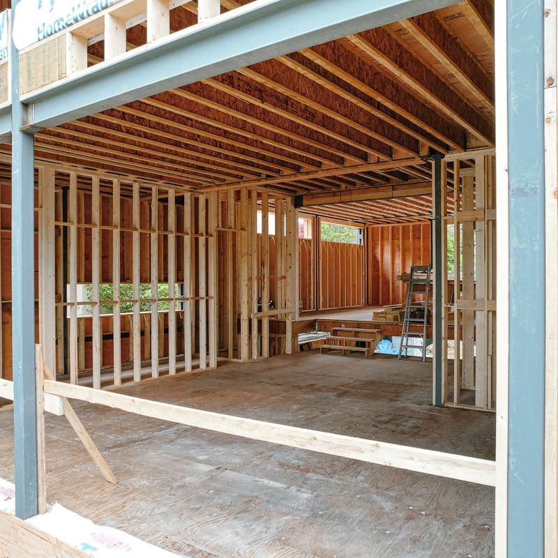 Steel column with base plate supporting beam