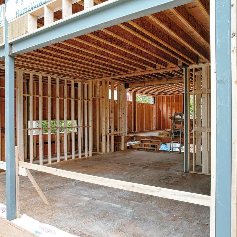 Steel column with base plate supporting beam